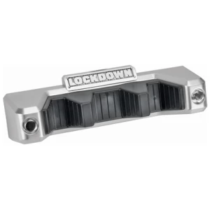 Lockdown Magnetic Barrel Rest attached to a safe, holding three long guns with rubberized contact points